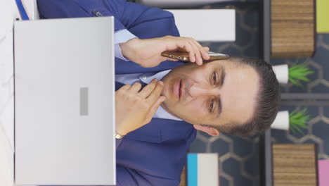 Vertical-video-of-Businessman-getting-bad-news-on-the-phone.